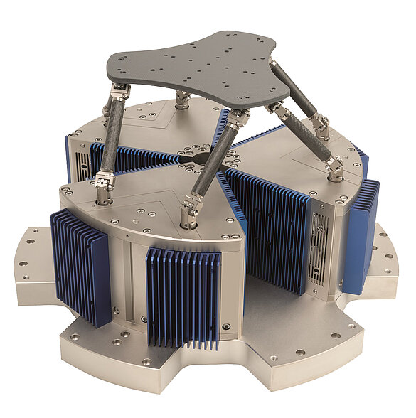 The H-860 uses non-contact linear motors with flexure guides (in the base of the hexapod) and frictionless and backlash-free flexure joints (top and bottom of each strut) along with carbon fiber parts to further reduce the moving mass. Click for a video showing its user selectable pivot point and capabilities (Image: PI)
