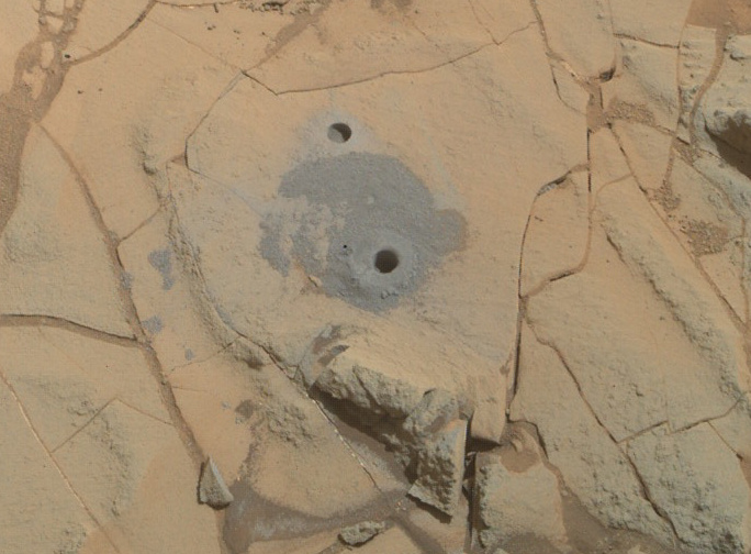 Curiosity’s drilling into a target called “Mohave 2” is visible surrounding the sample-collection hole in this January 31, 2015 image from the Rover’s MAHLI camera. This site in the “Pahrump Hills” outcrop provided the mission’s second drilled sample of Mars’ Mount Sharp. (Image: NASA/JPL-Caltech/MSSS)