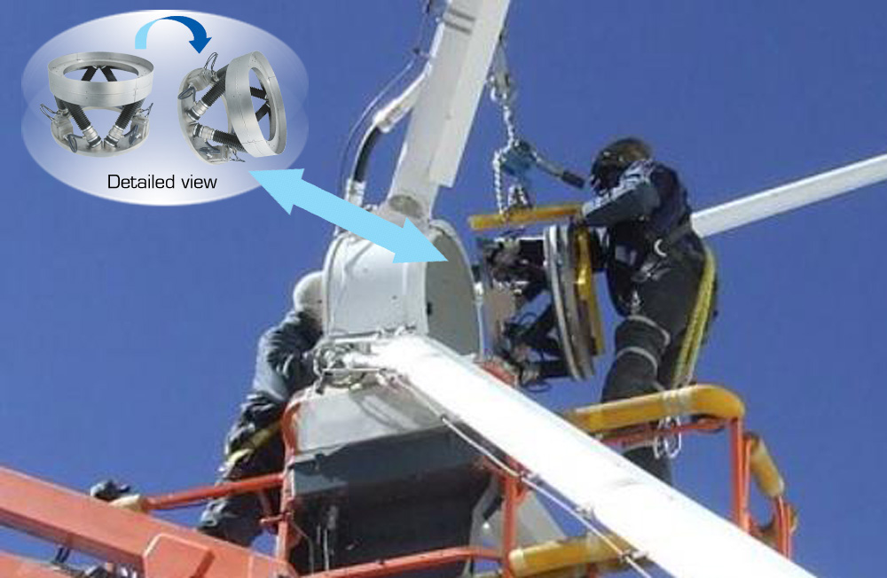 Engineers installing a PI Hexapod alignment system at a sub-reflector of an ALMA telescope. (Image: PI)